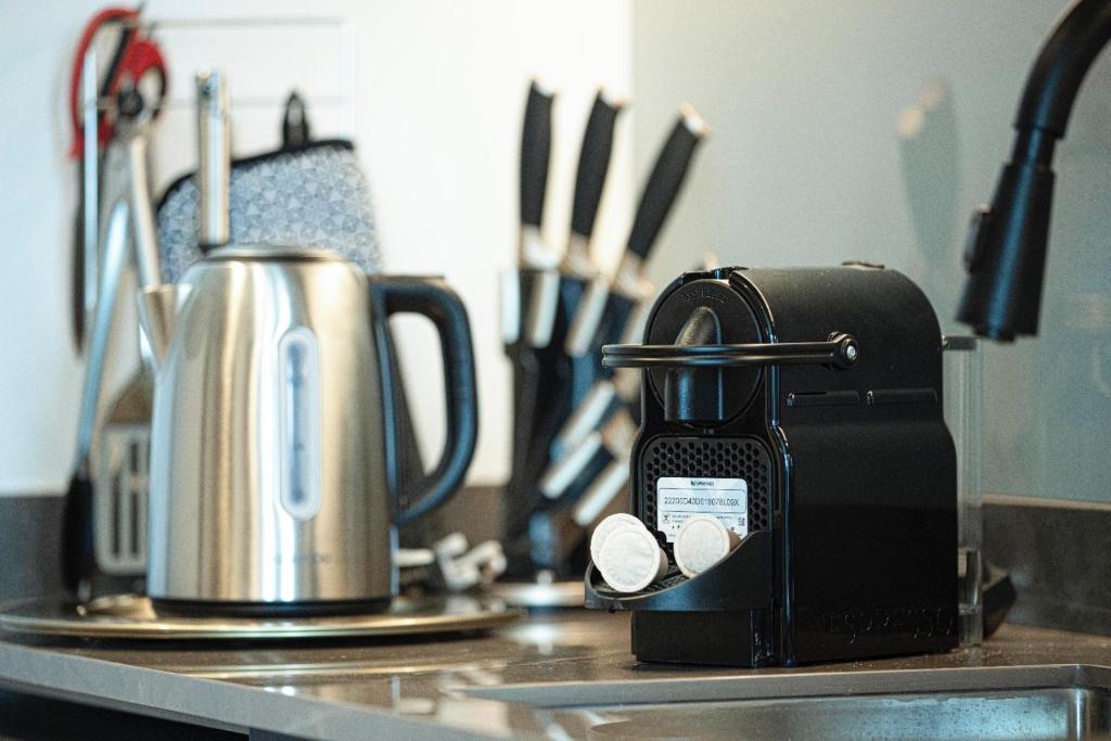 Kitchen counter with kettle, Nespresso machine and knife set