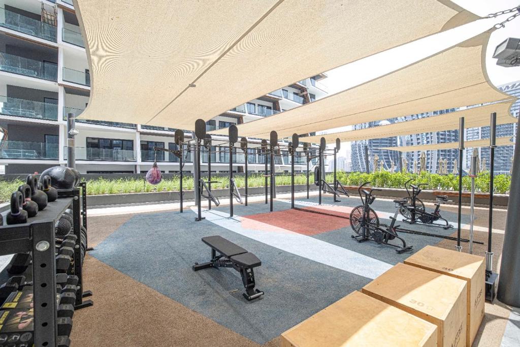 Open-air rooftop training deck with functional gym equipment