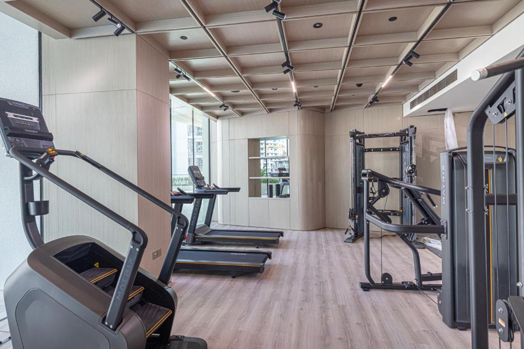 Fully equipped fitness center with treadmills and weight machines
