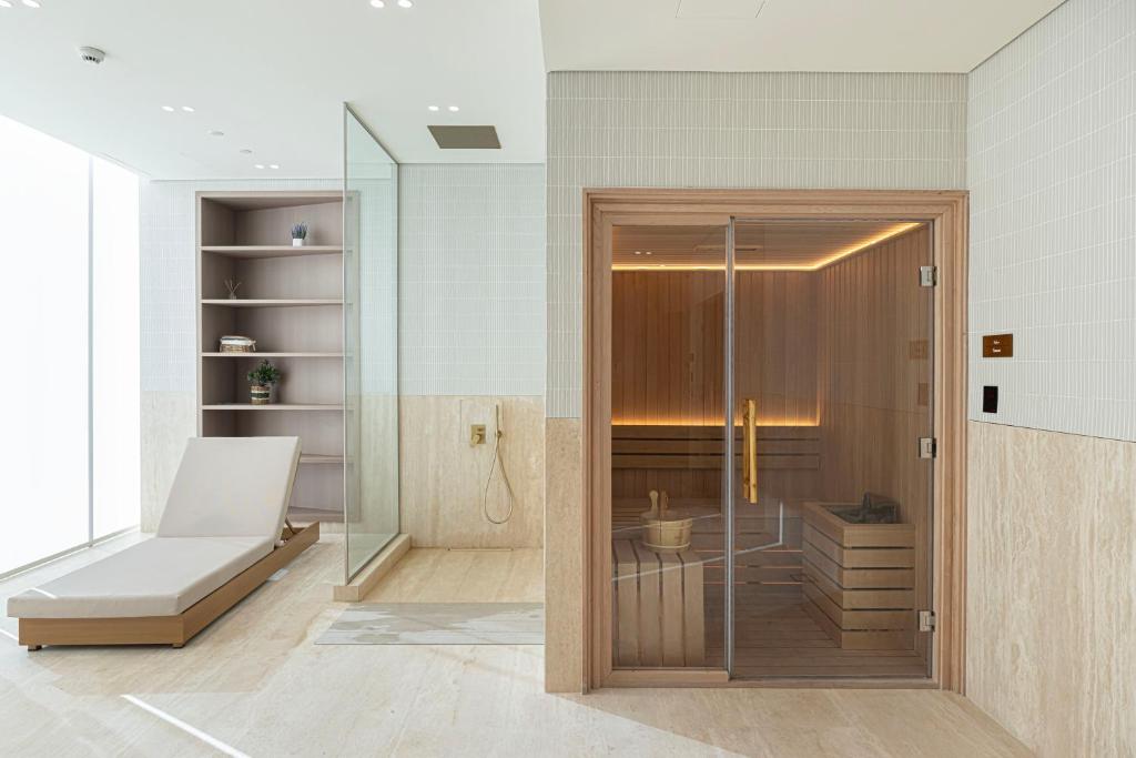 Spa relaxation area with a timber sauna cabin and lounger
